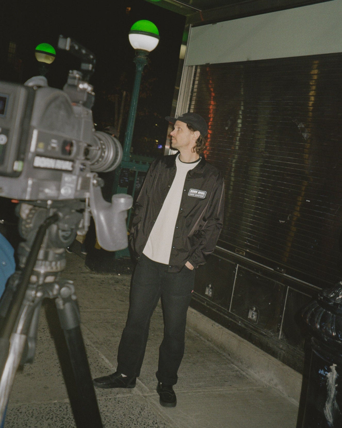 Person standing next to an ARRI SR3 16mm film camera on a street in New York City